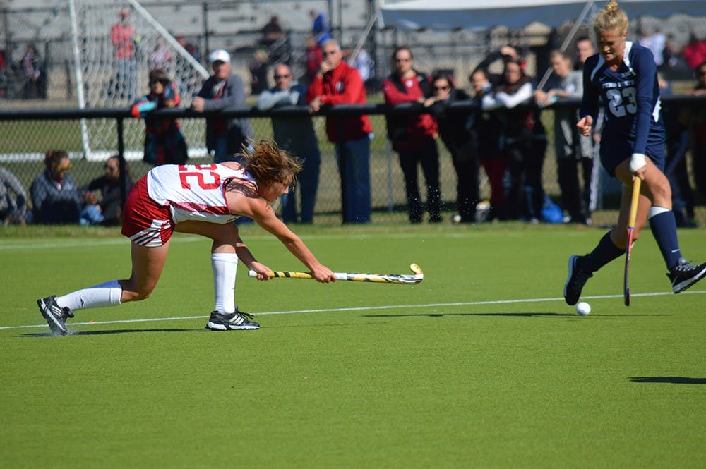 Freshman midfielder Charlie Kaste passes the ball during the game against Penn State Sunday afternoon at the IU Field Hockey Complex. The Hoosiers defeated the Nittany Lions 1-0.