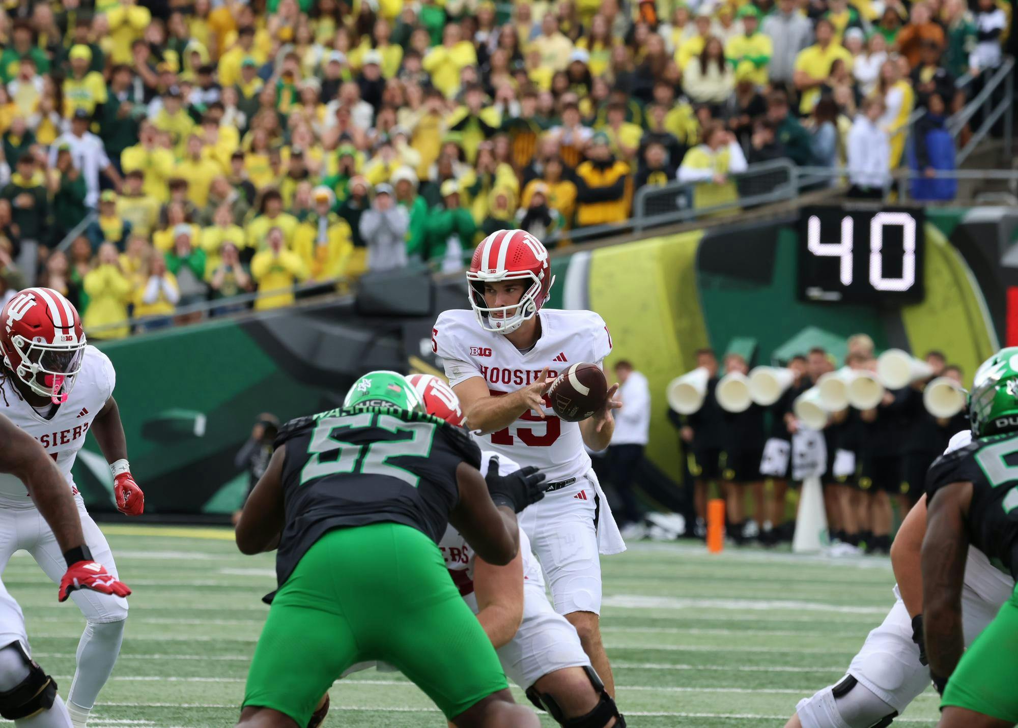 Indiana redshirt junior quarterback Fernando Mendoza catches the snap during the Hoosiers game against Oregon at Autzen Stadium on Oct. 11. Mendoza had 215 passing yards during the game against the Ducks.  