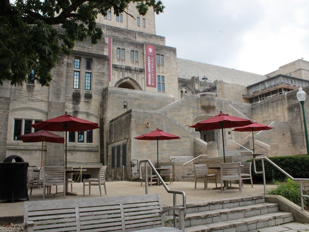 Tables and chairs sit Aug. 22 on the patio outside of the Indiana Memorial Union.