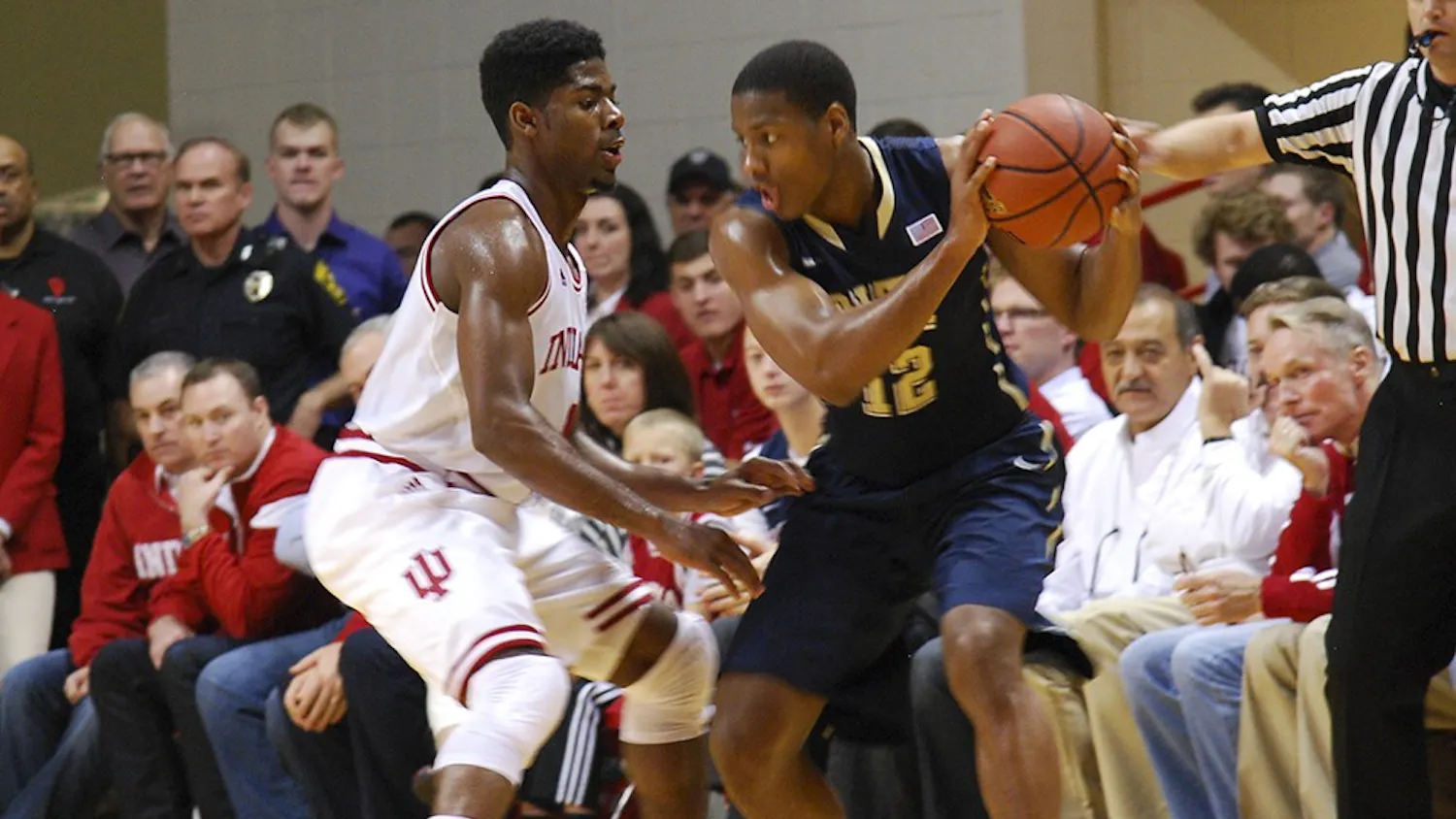 Freshman Rob Johnson defends his opponent during IU's game against Pittsburgh on Tuesday at Assembly Hall.