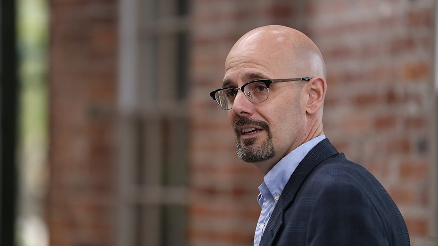 Mayoral candidate Daryl Neher speaks at a press conference in the City Hall atrium Monday evening. At the press conference, TKTKTKTK endorsed him publicly.