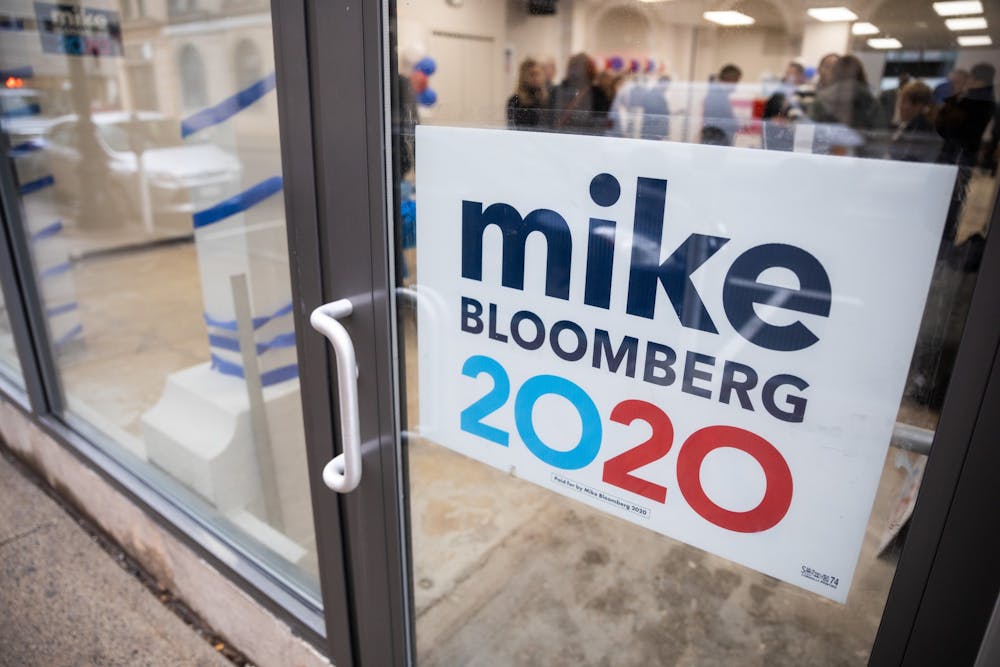 <p>A campaign sign for presidential candidate Mike Bloomberg hangs in a doorway.</p>