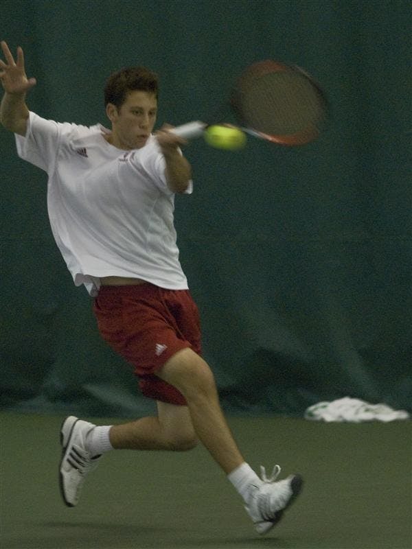 Freshman Jeremy Langer hits a forehand during his singles match against an opponent from Purdue Saturday. Langer lost his match 3-6, 6-2, 6-4. The men's tennis team will face the University of Illinois today. 