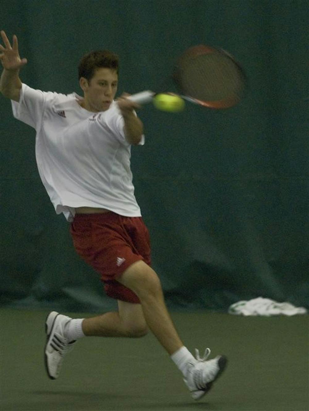 Freshman Jeremy Langer hits a forehand during his singles match against an opponent from Purdue Saturday. Langer lost his match 3-6, 6-2, 6-4. The men's tennis team will face the University of Illinois today. 