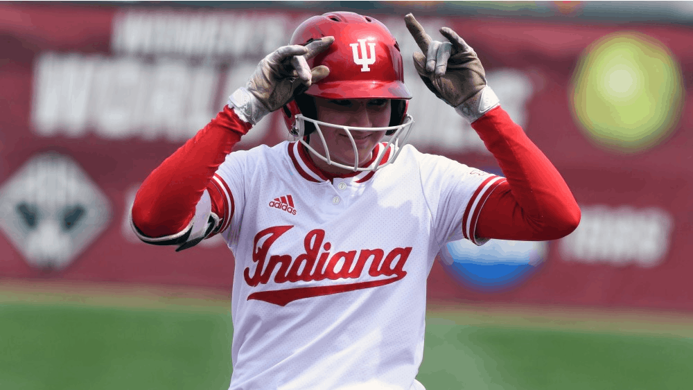 Freshman outfielder Taylor Lambert celebrates after making a run against Nebraska on Sunday afternoon at Andy Mohr Field. IU lost to Nebraska, 2-1. The Hoosiers will play at home against Butler on Tuesday night.