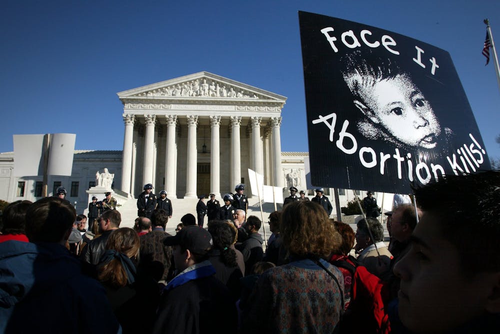 Anti-abortion protestors march January 22, 2022, the anniversary of the court's Roe v. Wade decision that legalized abortion, in front of the Supreme Court.