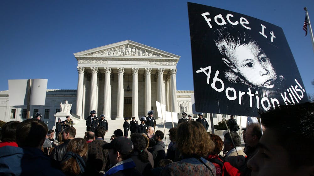 Anti-abortion protestors march January 22, 2022, the anniversary of the court's Roe v. Wade decision that legalized abortion, in front of the Supreme Court.