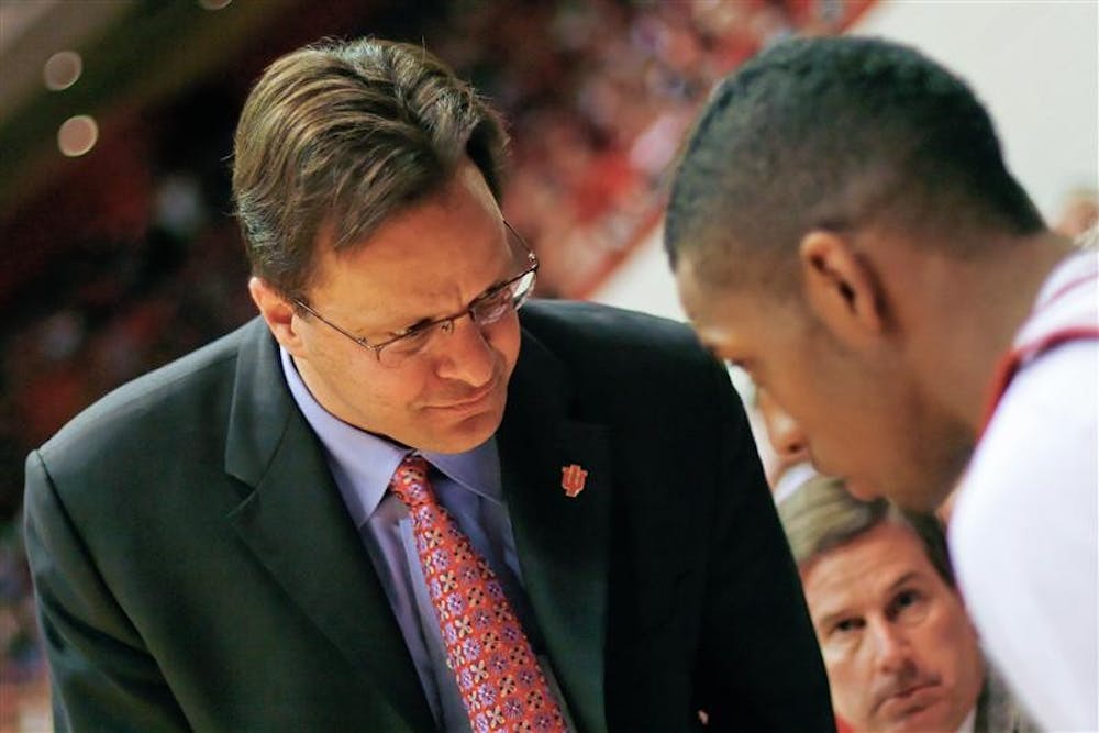 Coach Tom Crean checks on junior guard Devan Dumes following an injury during the Hoosiers 83-65 win over Northwestern State Saturday nite at Assembly Hall.