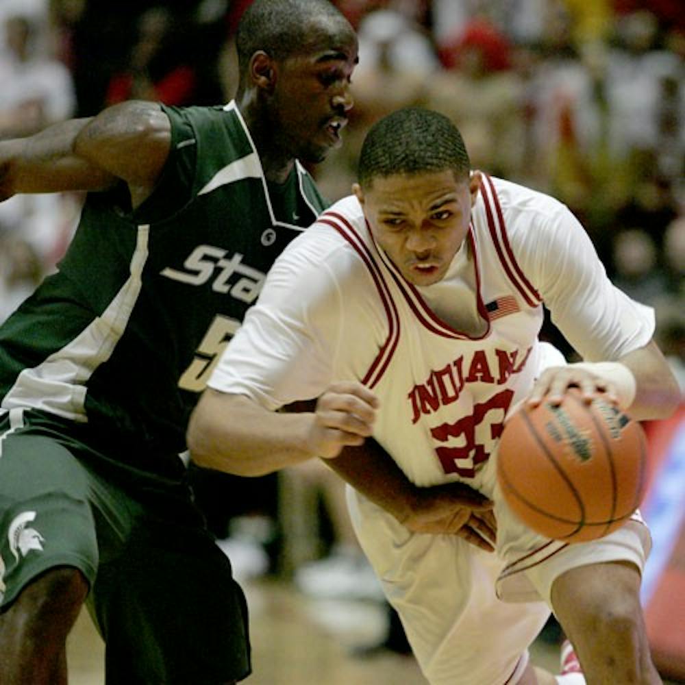 Freshman guard Eric Gordon, right, drives past a Michigan State defender during a 80-61 win on Feb. 16 at Assembly Hall. Gordon will enter the NBA draft this year.