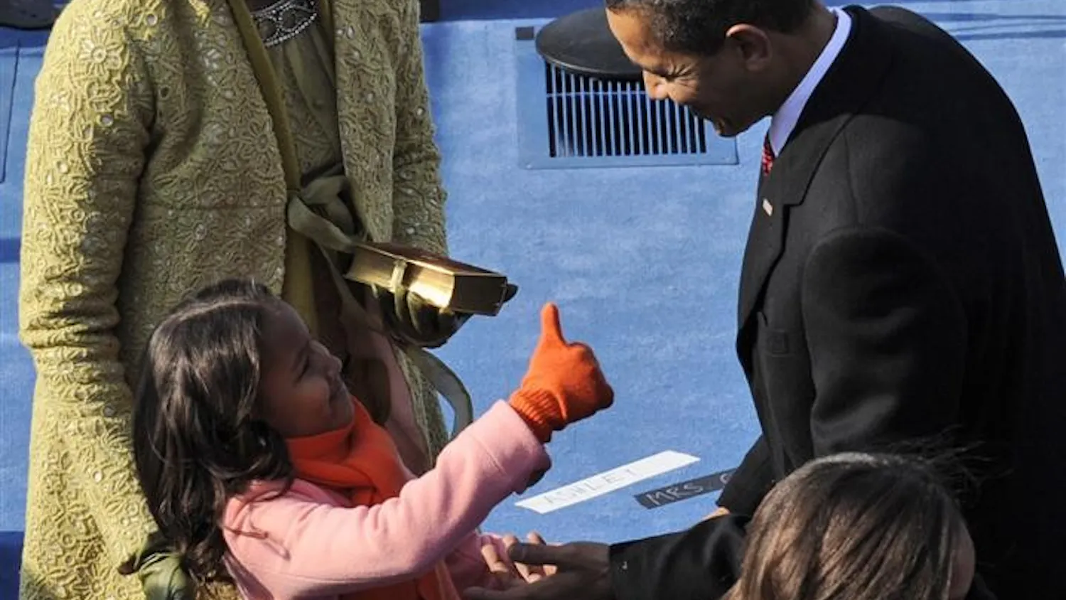 President Barack Obama, right, is congratulated by daughter Sasha, lower left, as first lady Michelle Obama looks on after Barack took the oath of office at the U.S. Capitol in Washington, Tuesday, Jan. 20.