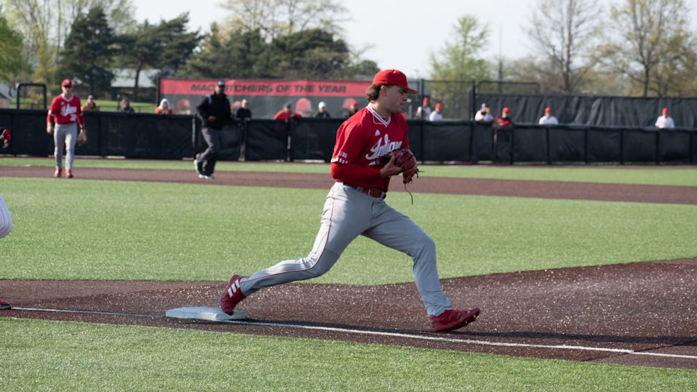Freshman right-handed pitcher Connor Foley gets an out at first April 25, 2023, ﻿against Ball State in Muncie, Indiana. The Hoosiers beat the Cardinals 9-8 on Tuesday.