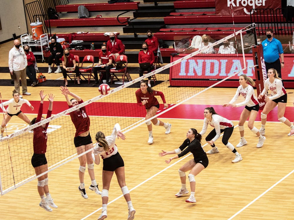 Then-freshman outside hitter Ashley Zuluaf spikes the ball against Wisconsin on Feb. 13, 2021. IU will play against Wisconsin at 8 p.m. Oct. 5, 2022, in Wilkinson Hall.