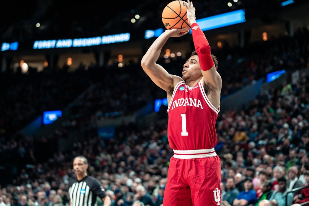 <p>Junior guard Rob Phinisee shoots a 3-point shot Mar. 17, 2022, at the Moda Center in Portland, Oregon. Indiana lost 53-82 against Saint Mary’s College.</p>