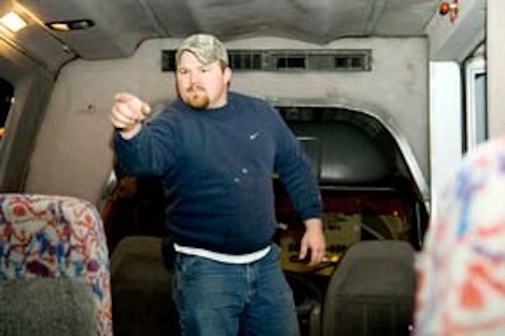 "Midnight Express" bus driver Larry Shaw lets everyone know who's in charge.