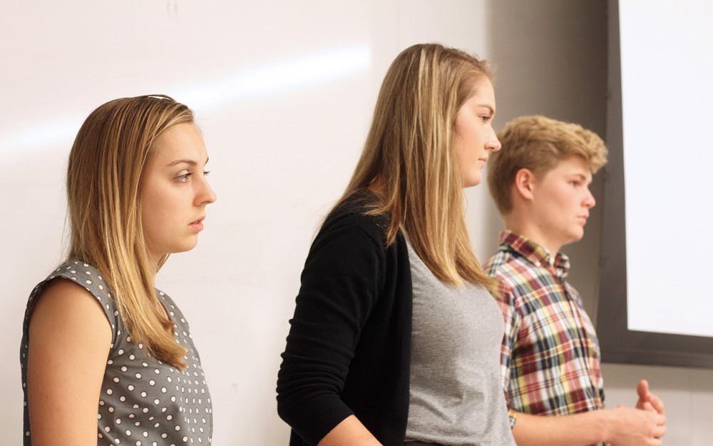 (From left to right) Sarah Masterson, Libby Gress, and Quinn Gordon pay attention to the IUSA Congress discussion prior to electing the Election Commission Appointees on Tuesday.