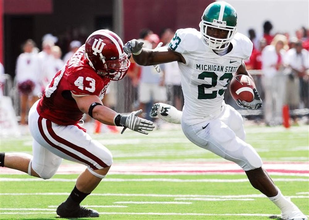 Michigan State's Javon Ringer finds an opening in the IU defense during the Spartans' 42-29 win on Saturday at Memorial Stadium. Ringer had 198 yards on 44 carries.