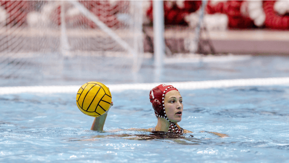 Graduate student Mary Askew looks to throw the ball April 1, 2023, at Councilman Billingsley Aquatic Center in Bloomington. Indiana water polo hosts Michigan Saturday afternoon.