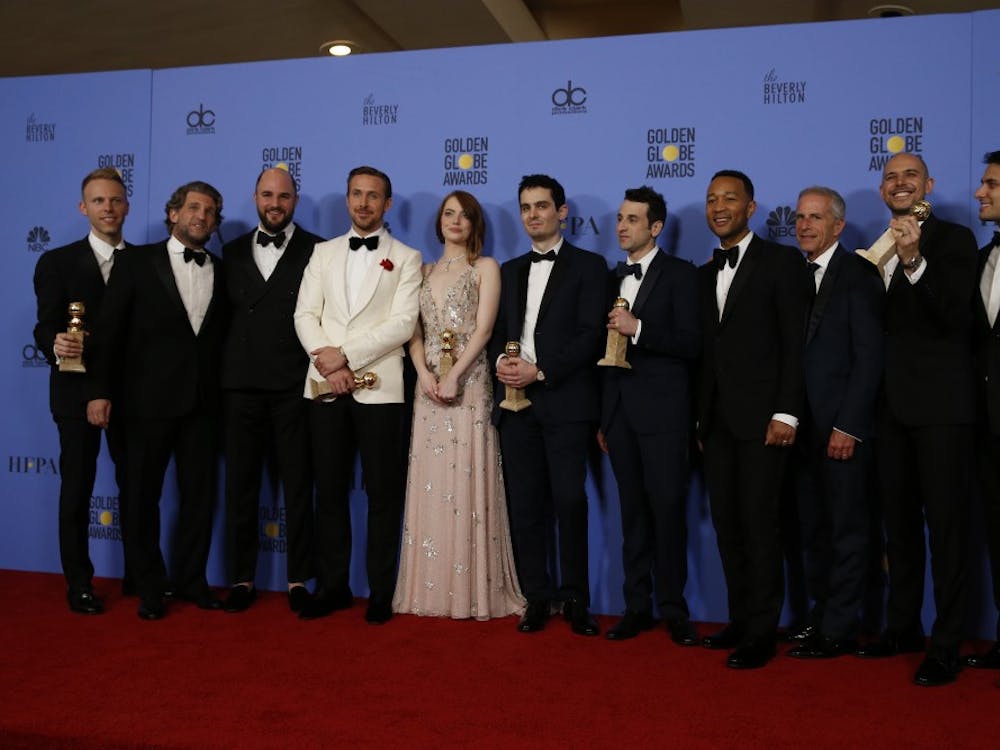 Ryan Gosling, Emma Stone, and director Damien Chazelle along with cast and producers of "La La Land" backstage at the 74th Annual Golden Globe Awards show at the Beverly Hilton Hotel in Beverly Hills, Calif., on Sunday, Jan. 8, 2017. (Allen J. Schaben/Los Angeles Times/TNS)