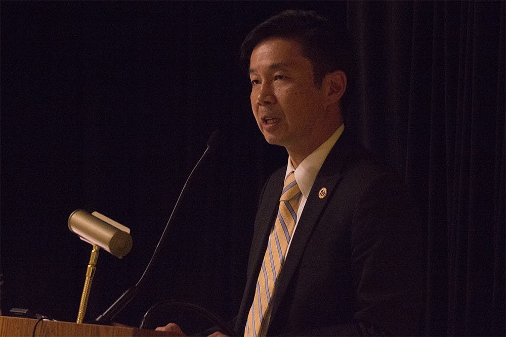 Grande Lum, Director of the Community Relations Service, lectures for an audience on Thursday night in the Monroe County Public Library. 