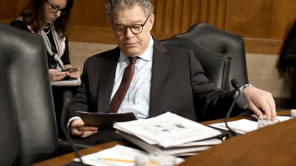 U.S. Sen. Al Franken (D-Minn.) looks over his notes prior to hearing Alex M. Azar II testify before the Senate Committee on Health, Education, Labor and Pensions on his nomination to be Secretary of Health and Human Services on Wednesday, Nov. 29 on Capitol Hill in Washington, D.C. A series of Senate Democratic women issued calls for Franken to resign that morning.