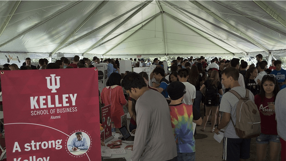 Students pile into the tent outside Hodge Hall for the Kelley Carnival Friday afternoon. The students go from booth to booth to learn about all the programs and organizations Kelley has within the school.