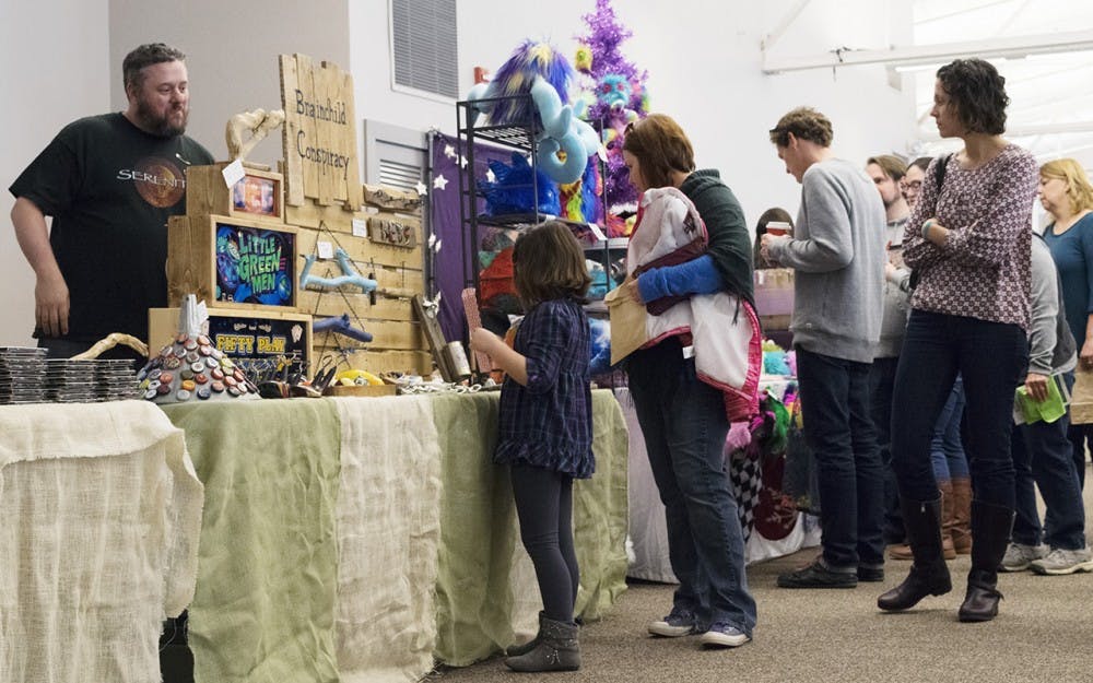 Some vendors, like Brainchild Conspiracy, appeal to children and adults alike. Hundreds of visitors go to the Bloomington Convention Center to browse among local and handmade products. Approximately $30,000 will be spent supporting local artists and artisans.