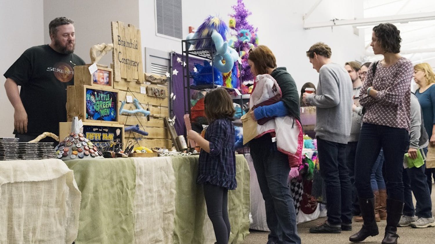 Some vendors, like Brainchild Conspiracy, appeal to children and adults alike. Hundreds of visitors go to the Bloomington Convention Center to browse among local and handmade products. Approximately $30,000 will be spent supporting local artists and artisans.
