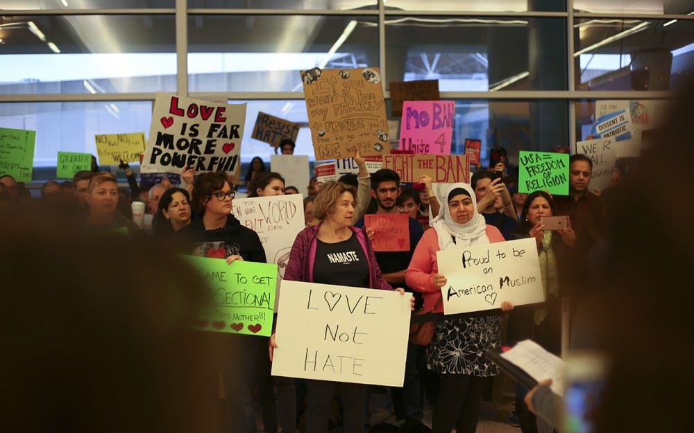 Protestors of the Trump Administration's proposed travel ban and construction of a border along the Mexican U.S. border demonstrate at the Indianapolis International Airport Jan. 29th, 2017.  The nonviolent protests featured a series of speakers, including Indiana State Senator Joe Donelly, that encouraged the crowd to remain united and to continue to work for social justice.   