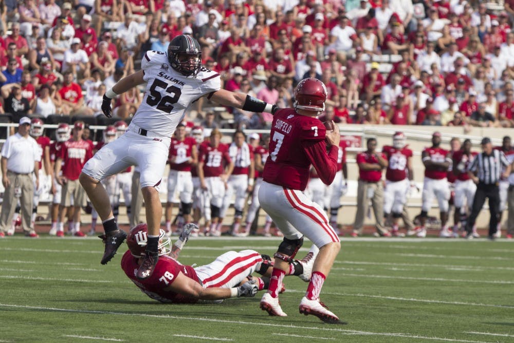 Quarterback Nate Sudfeld attempts to pass the ball before being sacked by SIU offensive line backer Blake Mattson on Saturday in Memorial Stadium. IU defeated SIU 48-47.