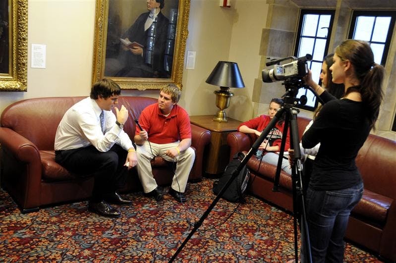 Luke Russert, a correspondent for NBC and MSNBC, speaks to IUSTV reporter Nick James during an interview Tuesday in the IMU's East Lounge. Russert, who reports primarily on youth issues, broadcasted live from IU throughout the day.