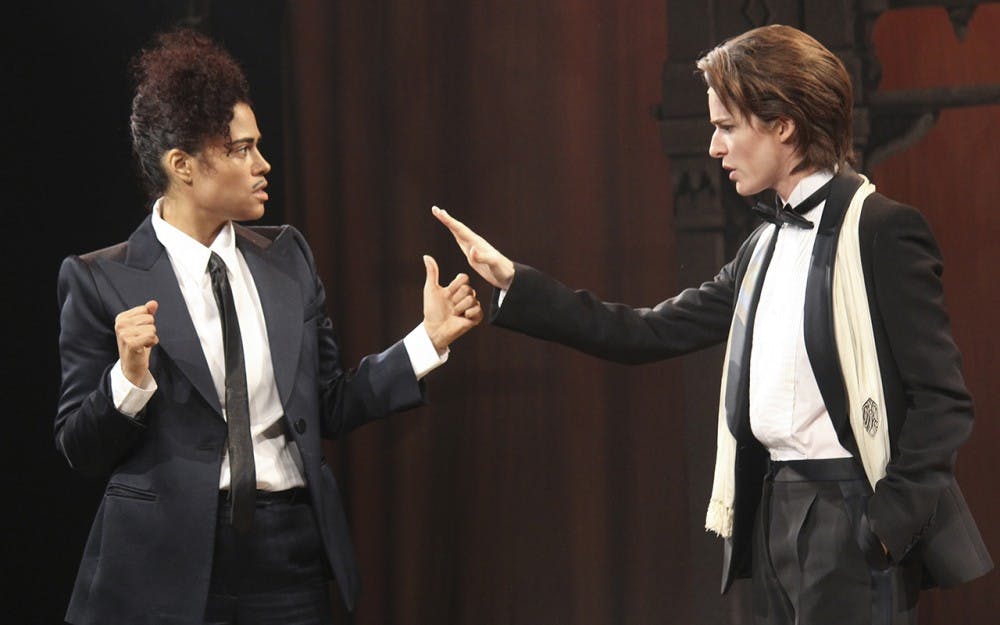 Yadira Correa and Caitlan Taylor speak to each other during a dress rehearsal for Cardinal Stage Company's presentation of The Merchant of Venice. Correa and Taylor played Gratiano and Bassanio respectively in the production.