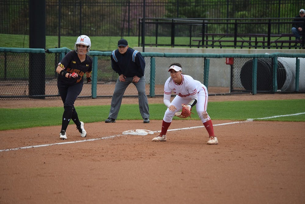 Freshman utility player Katie Lacefield covers the left side of the infield while a Maryland player takes a lead off third base on Friday, April 21, 2017. The Hoosiers defeated the Terrapins in all three games in Bloomington.