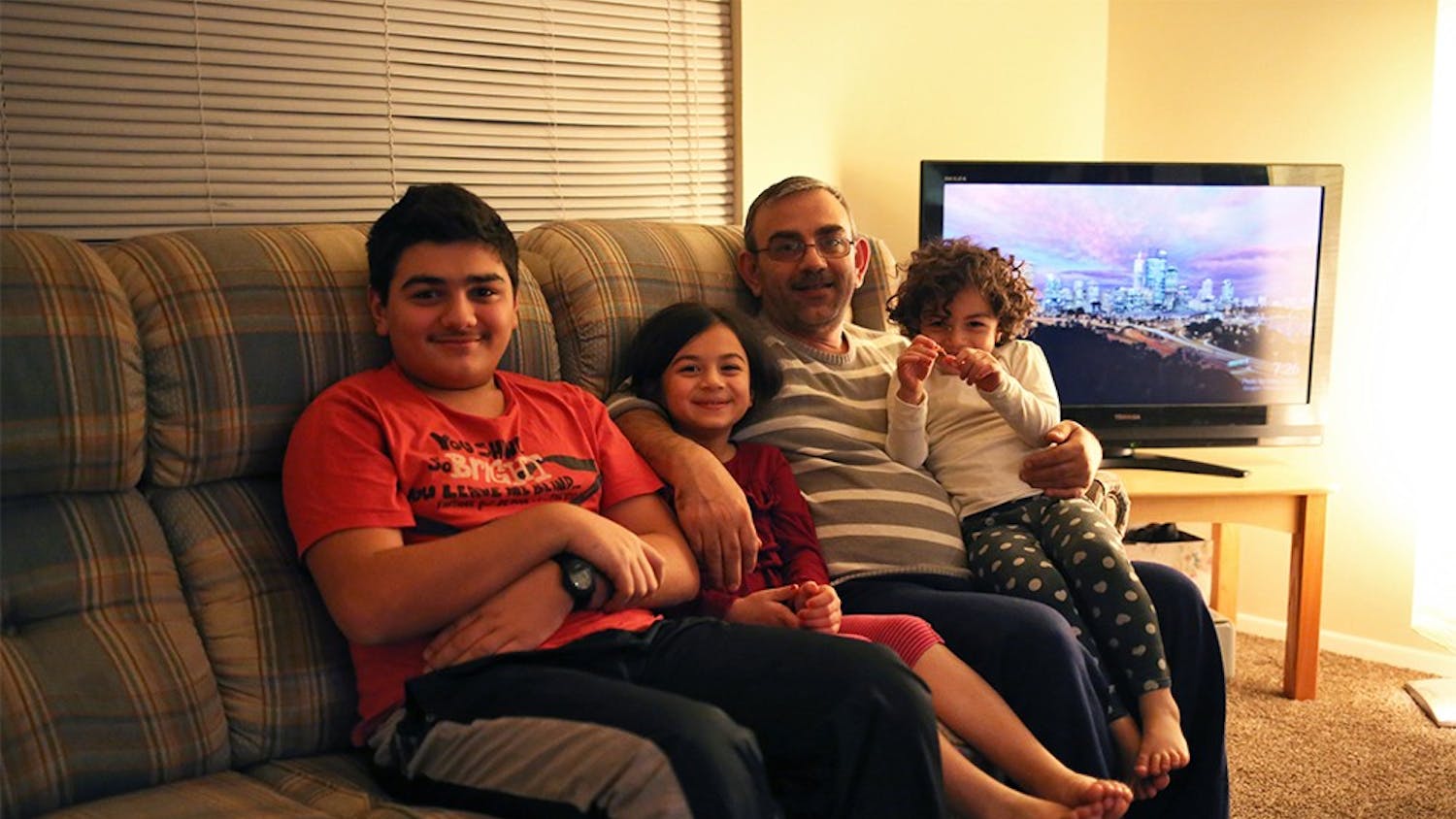 The Batman family settled in Indianapolis about a year ago after fleeing war-torn Syria in 2012. Marwan, the father, works in a restaurant to provide for his wife and four children (wife and oldest daughter not pictured). On Monday, Gov. Mike Pence called for the resettlement of additional Syrian refugees in Indiana to be suspended, following Friday's attack in Paris carried out by ISIS. More than 20 states announced similar plans. 