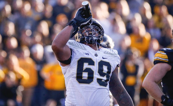 Greg Long, a Boilermaker offensive lineman, took a beer thrown from the fans and doused himself in celebration.
