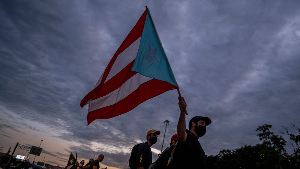 A man holding a Puerto Rican flag is pictured Oct. 15, 2021, in San Juan, Puerto Rico. 