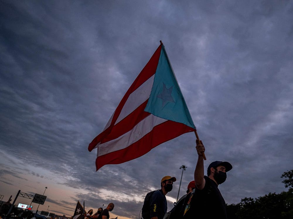 A man holding a Puerto Rican flag is pictured Oct. 15, 2021, in San Juan, Puerto Rico. 
