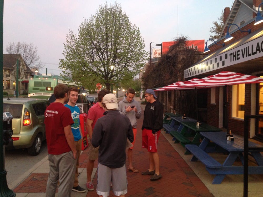 A group of sophomores stand outside of Village Deli on Friday morning. The boys were the first customers in line for the re-opening of the restaurant. 