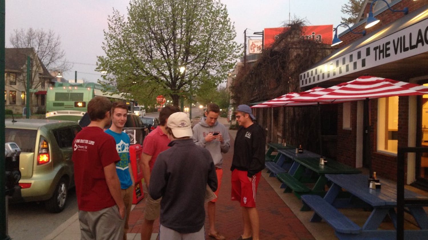 A group of sophomores stand outside of Village Deli on Friday morning. The boys were the first customers in line for the re-opening of the restaurant.