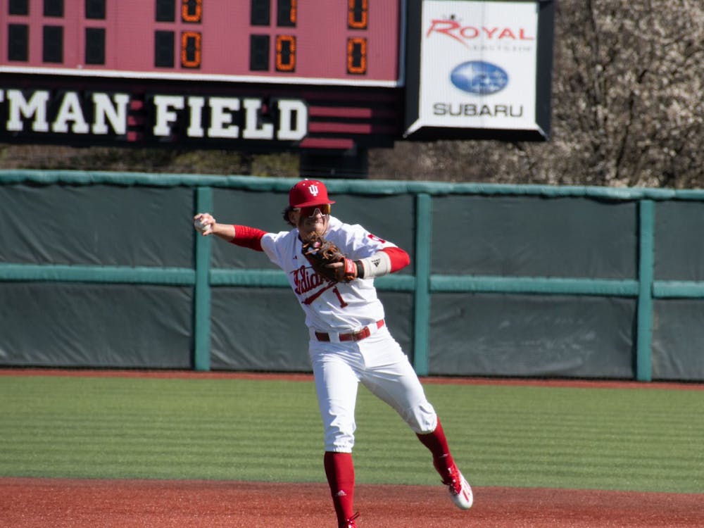 Senior shortstop Philip Glasser throws the ball to first base March 26, 2023, at Bart Kaufman Field in Bloomington. Indiana baseball faces Penn State this weekend.﻿
