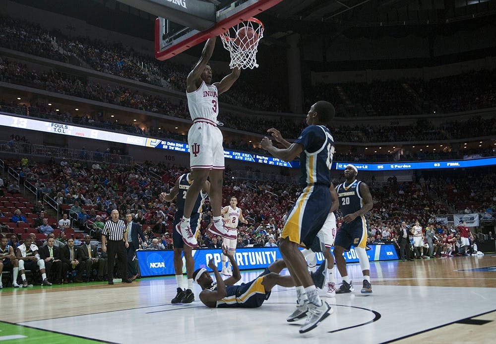 Freshman forward OG Anunoby dunks during the NCAA Tournament game against Chattanooga on Thursday at the Wells Fargo Arena in Des Moines, Iowa.