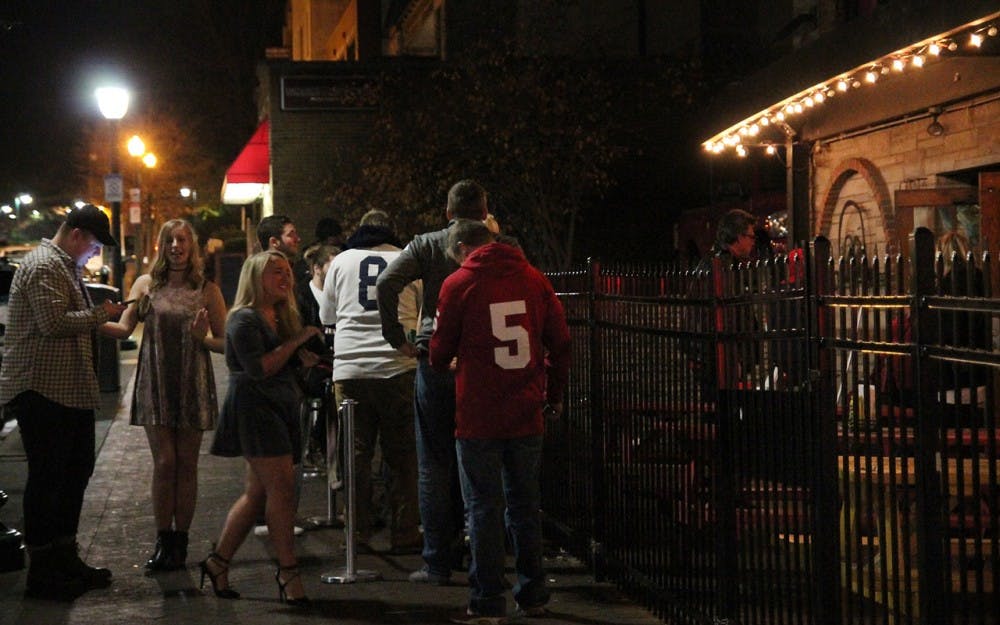 The cold of winter is not a deterrent enough for everyone, as this young woman simply wears a dress out in Bloomington, Ind. on Nov. 12, 2016. Even as the weather will continue to get colder, some women will insist on wearing skin-baring outfits to go out.