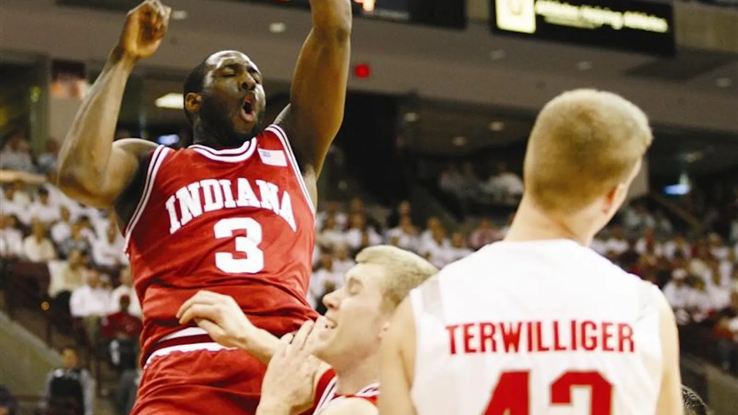 Senior forward D.J. White slams the ball over teammate Lance Stemler and Ohio State's Matt Terwilliger (42) on Feb. 10 in Columbus, Ohio. White is now donning the same No. 3 for the NBA's Oklahoma City franchise.