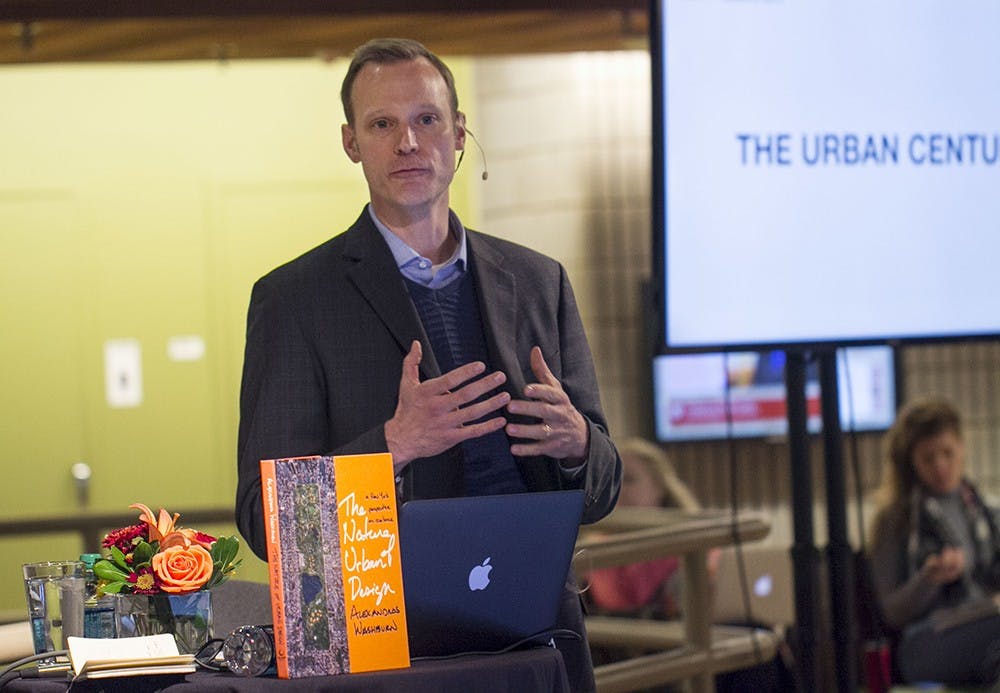 Editor Franklyn Cater describes how cities are preparing for climate change as part of the NPR "Cities Project" in the SPEA atrium on Thursday afternoon.