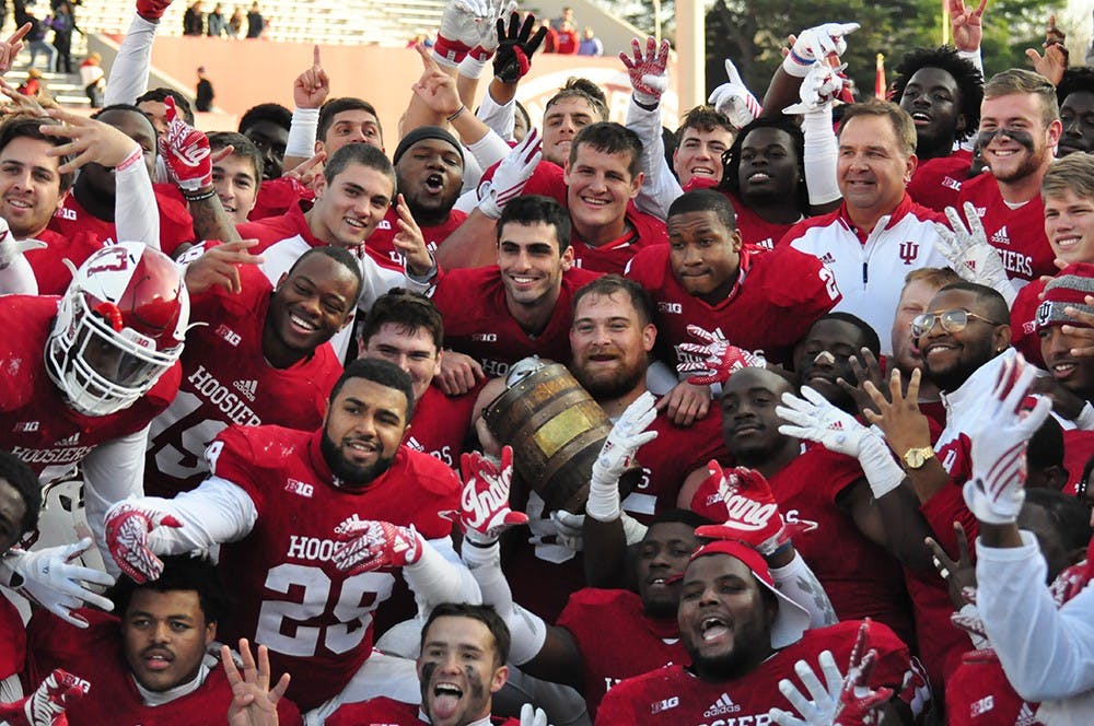 The Hoosiers celebrate their victory against Purdue on Saturday at Memorial Stadium. IU won 26-24 to win the old oaken bucket trophy for the fourth-straight year.