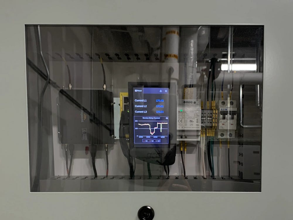An energy monitoring kit installed and connected to a machine at the Emerging Manufacturing Collaboration Center, is seen in Indianapolis&#x27; 16 Tech Innovation District. Researchers at IU are using artificial intelligence and machine learning to help manufacturers statewide reduce their carbon footprint.