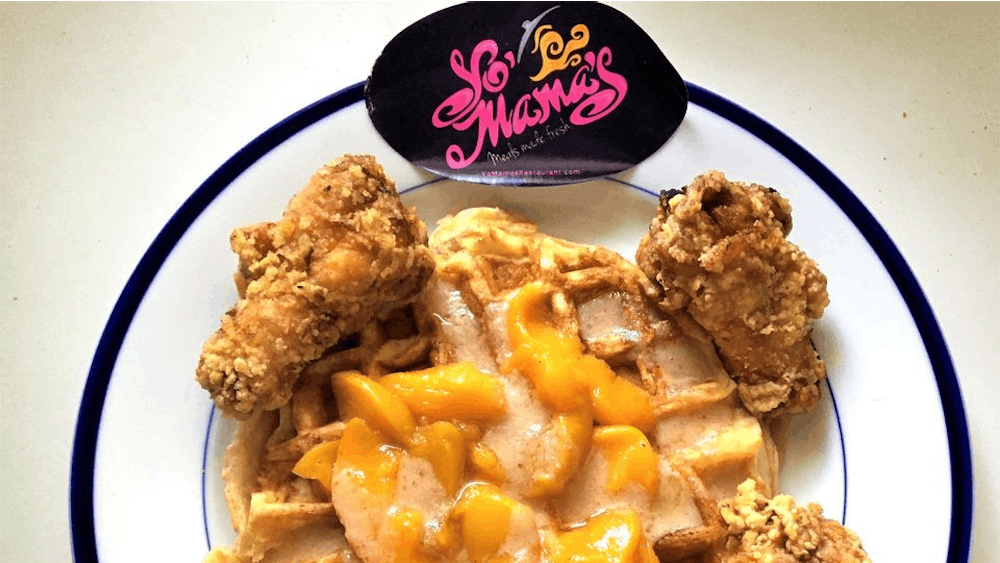 The peach cobbler chicken and waffles at Yo' Mama's Restaurant in Birmingham, Alabama, combines two Southern soul food favorites in one dish.