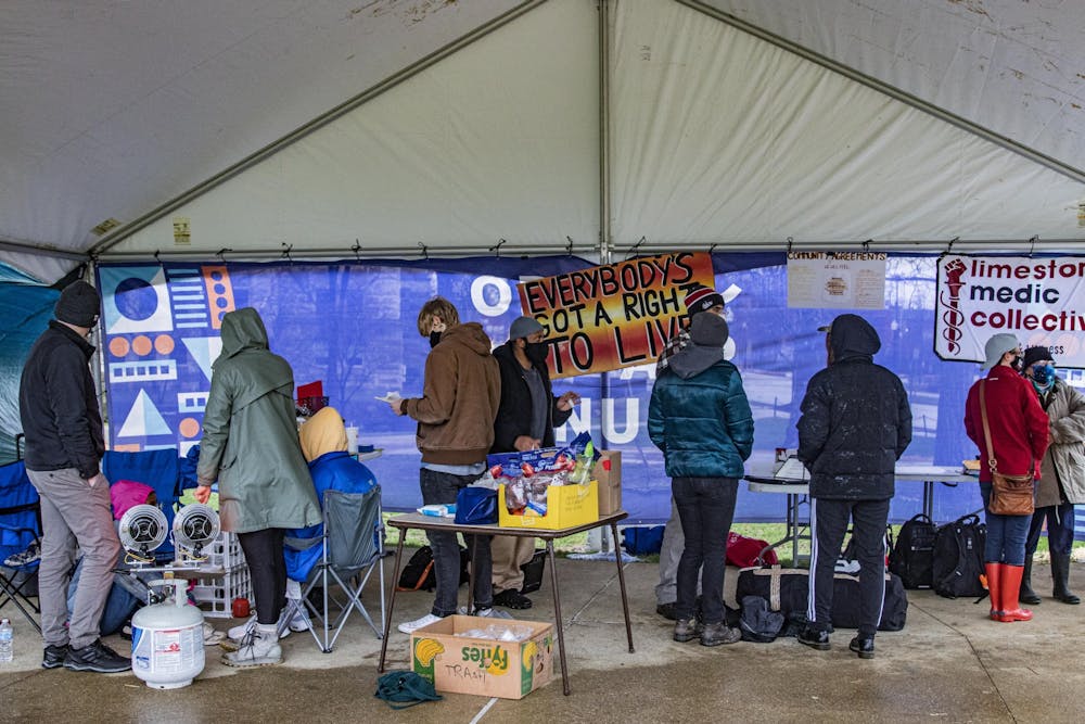 <p>People gather together for March To End The Madness on March 18 in Dunn Meadow. Demonstrators gathered in solidarity with the city&#x27;s unhoused community.</p>