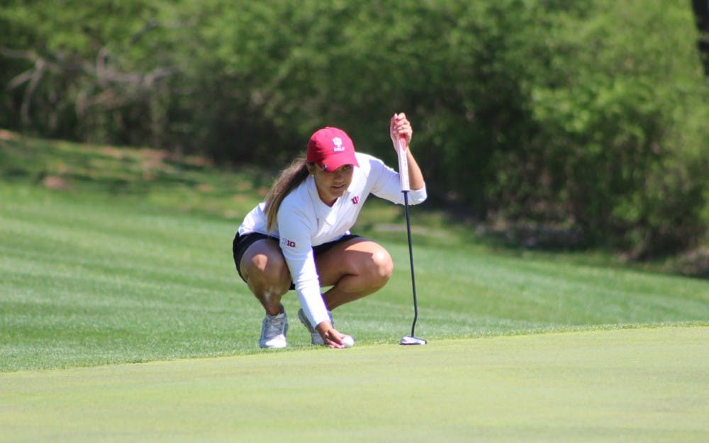 Senior Theresa-Ann Jedra lines up a putt as she competes Saturday in the IU Invitational at IU Golf Course. The senior posted a 3-over par Saturday after two rounds.