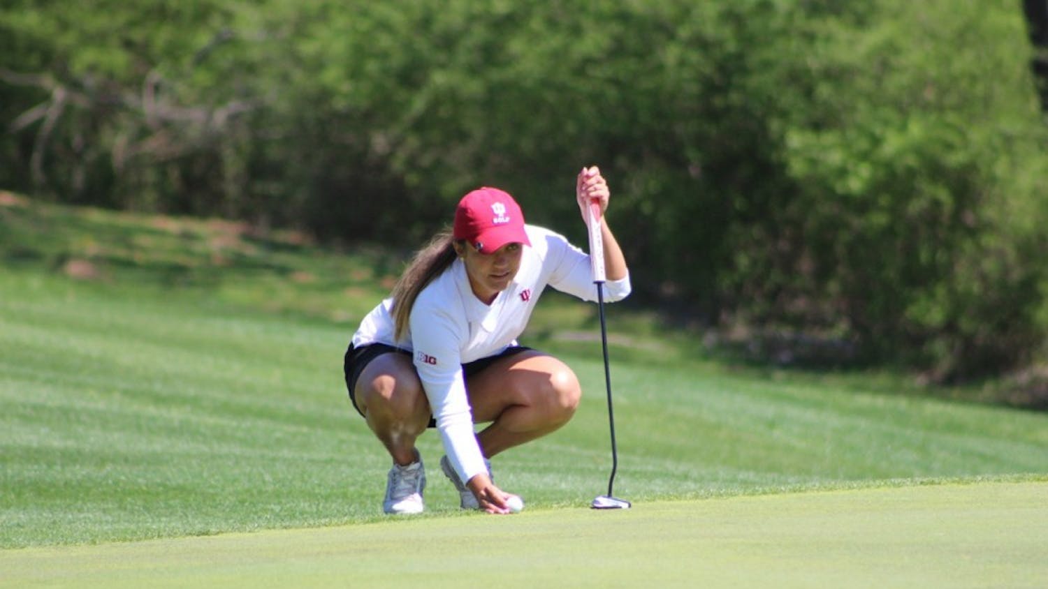 Senior Theresa-Ann Jedra lines up a putt as she competes Saturday in the IU Invitational at IU Golf Course. The senior posted a 3-over par Saturday after two rounds.