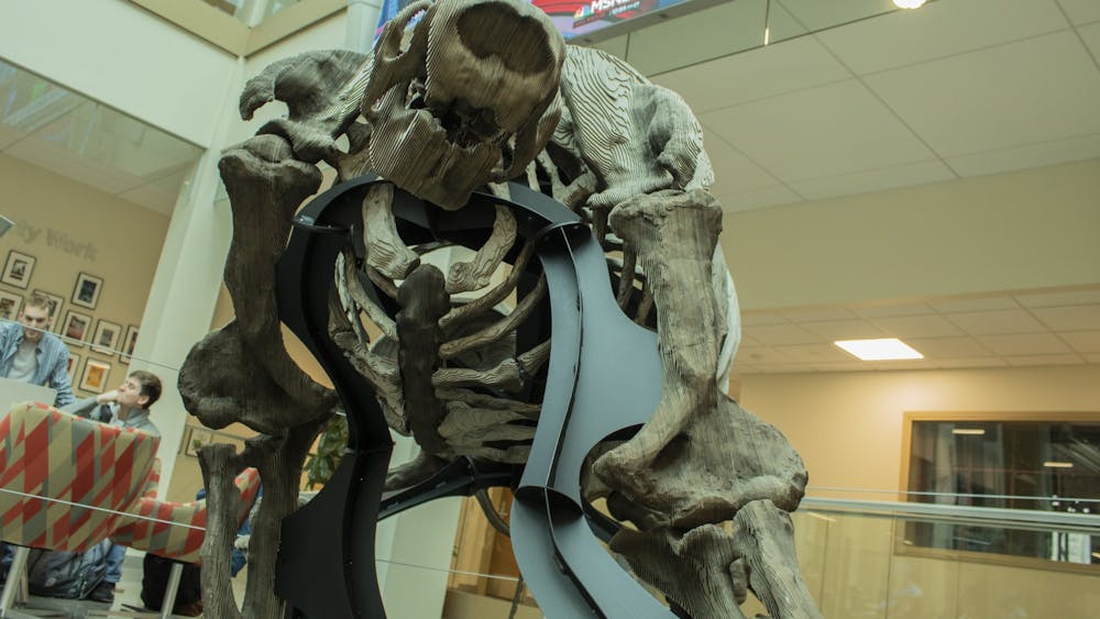 The reconstructed Megalonyx Jeffersonii, a type of giant ground sloth, stands March 12 in the Franklin Hall Commons.